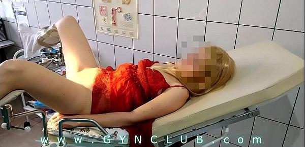  Woman in red dress on gyno exam